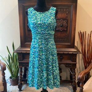 Sleeveless A-line dress. Green turquoise, and cobalt.